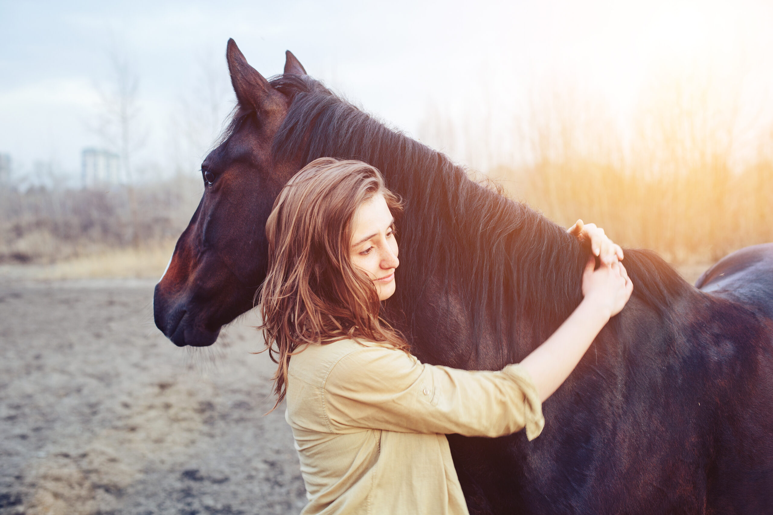 Beautiful,Young,Female,Walking,And,Hugging,With,Her,Brown,Horse